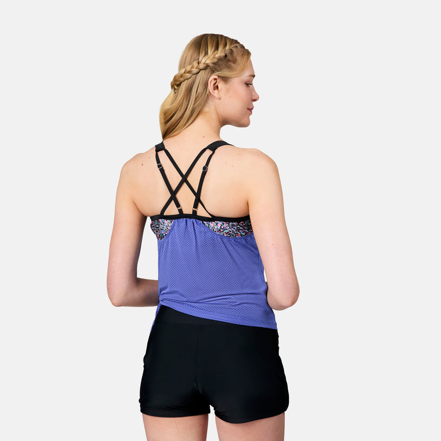 [Emily is 5'10" wearing size S] Woman wearing a purple athletic top and black shorts on a white background