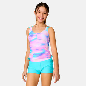 [Model is wearing a size Medium.] Girl wearing the Free Country Girls' Dreamy Drift Tankini Swim Set in Aquatopia Dreamy Drift, size M, featuring a double strap tankini and boy shorts made from recycled polyester fabric that provides four way stretch and upf protection #color_ Aquatopia-Dreamy-Drift