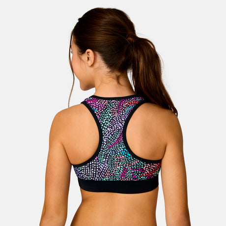 [Model is wearing a size Medium.] Girl wearing the Free Country Girls' Fresco Rash Guard and Bikini Swim Set in Black Fresco, size M, featuring a raglan sleeve rash guard and racerback tankini top and lined bikini bottom made from recycled polyester fabric that provides four way stretch and upf protection #color_ Black-Fresco