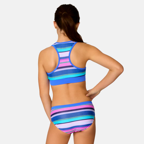 [Model is wearing a size Medium.] Girl wearing the Free Country Girls' Fresco Rash Guard and Bikini Swim Set in Peri Marina Stripe, size M, featuring a raglan sleeve rash guard and racerback tankini top and lined bikini bottom made from recycled polyester fabric that provides four way stretch and upf protection #color_ Peri-Marina-Stripe