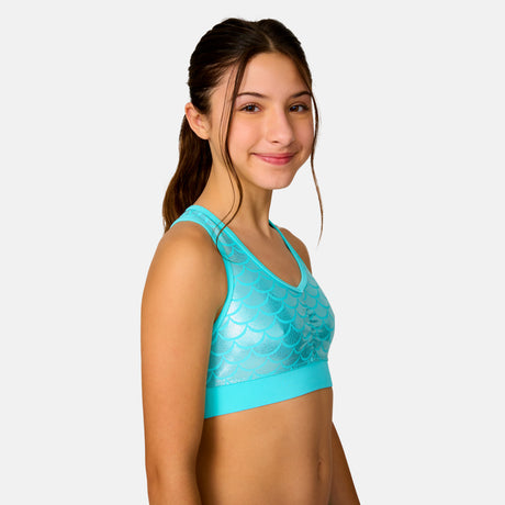 [Model is wearing a size Medium.] Girl wearing the Free Country Girls' Foil Mermaid Rash Guard and Bikini Swim Set in Aquatopia Foil Mermaid, size M, featuring a raglan sleeve rash guard and racerback tankini top and lined bikini bottom made from recycled polyester fabric that provides four way stretch and upf protection #color_ Aquatopia-Foil Mermaid