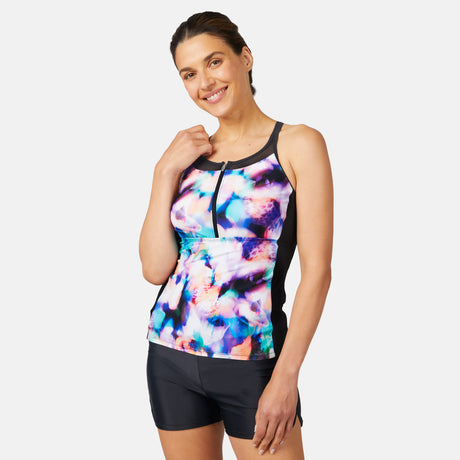 [Olga is 5'10" wearing a size S.] Woman wearing a colorful tank top and black shorts on a white background