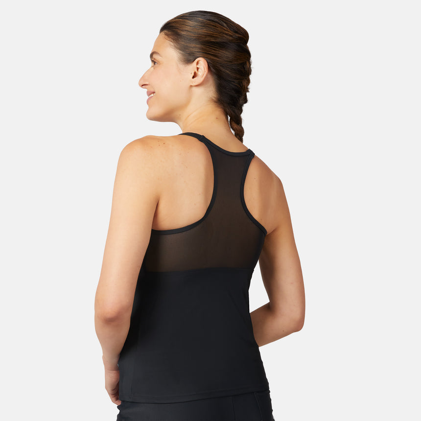 [Olga is 5'10" wearing a size S.] Woman wearing a colorful tank top and black shorts on a white background