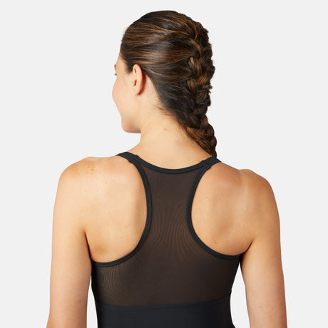 [Olga is 5'10" wearing a size S.] Woman wearing a black mesh tank top with a plain background