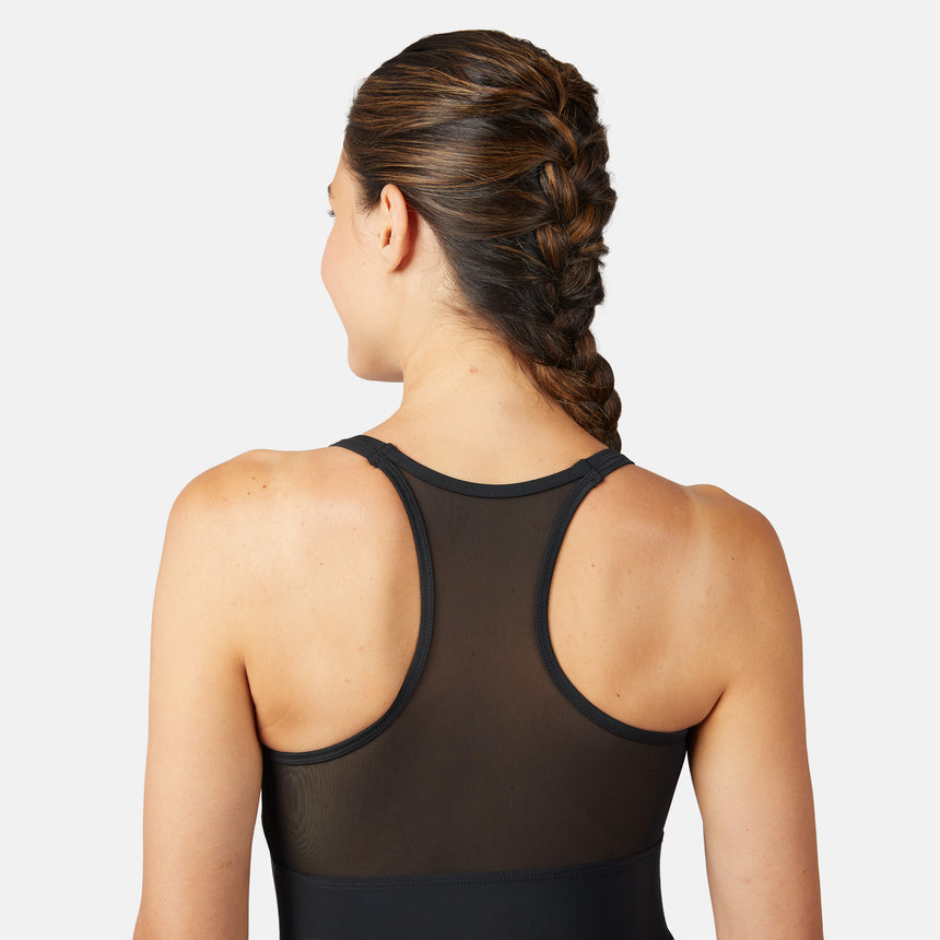 [Olga is 5'10" wearing a size S.] Woman wearing a black mesh tank top with a plain background