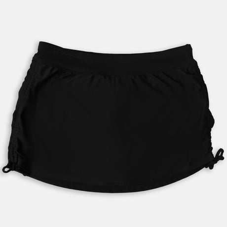 The Free Country Women's Side Shirred Swim Skirt in black features adjustable side ties, a wide waistband, and a built-in brief, shown against a white background.