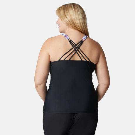 [Lola is 5'10" wearing size S] Woman wearing a black tank top with criss-cross straps on a white background