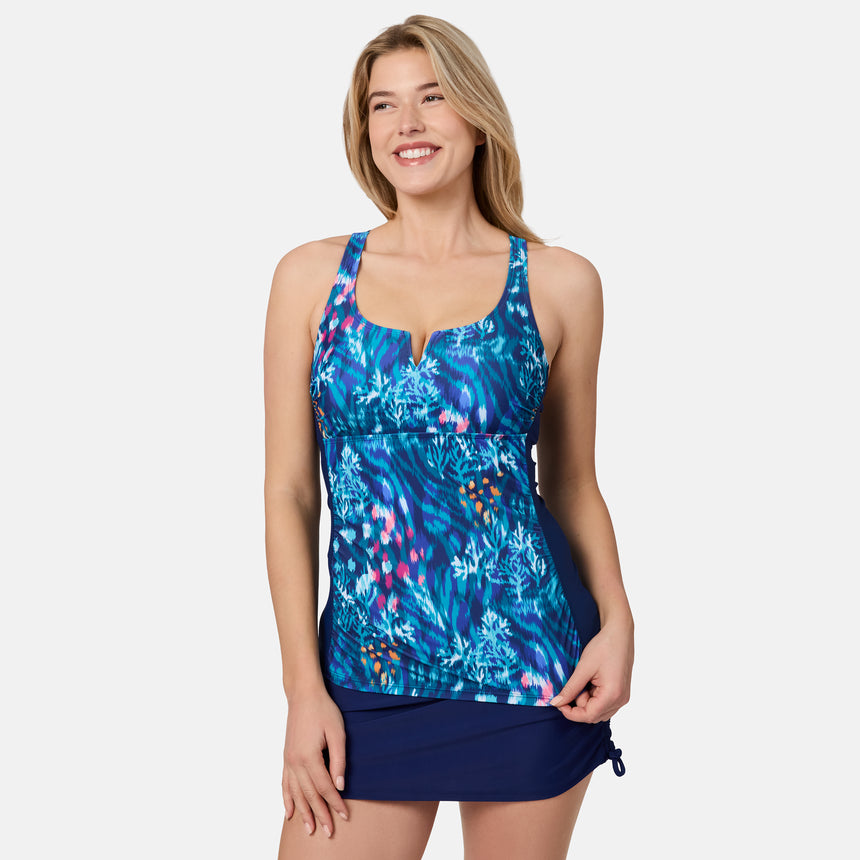 [London is 5'9.5" wearing size S] Woman wearing a blue floral tankini set on a white background