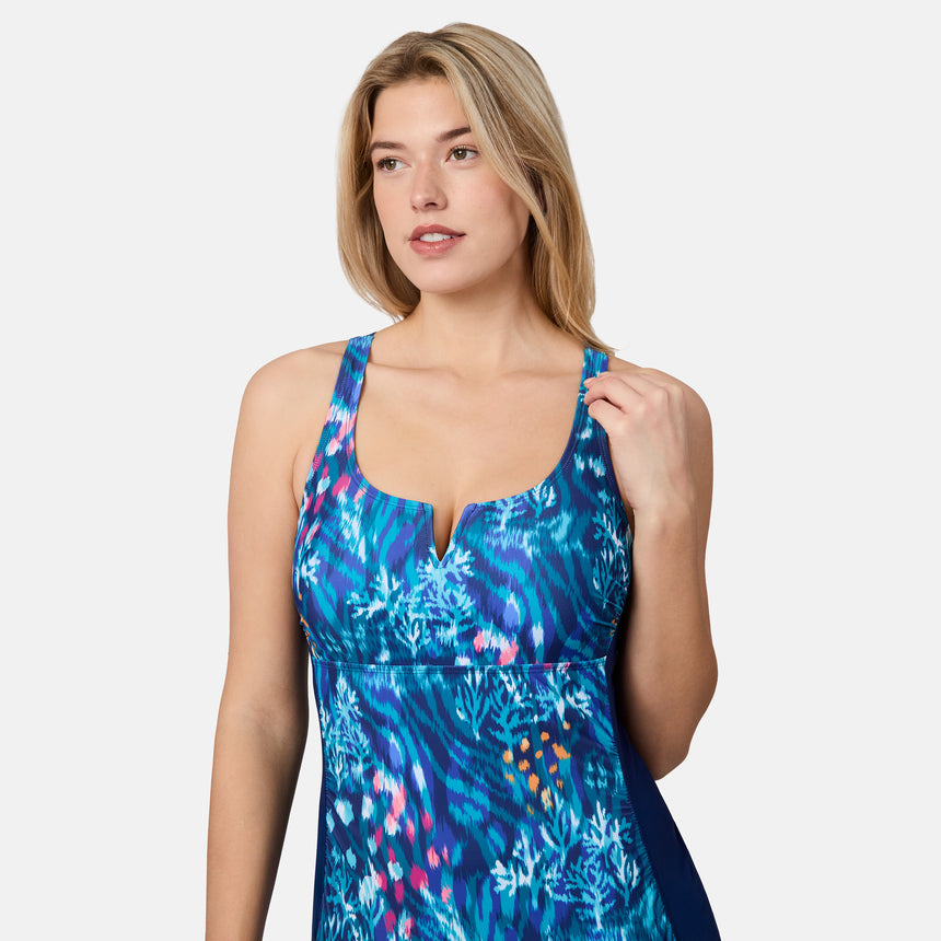 [London is 5'9.5" wearing size S] Woman wearing a blue floral dress on a white background