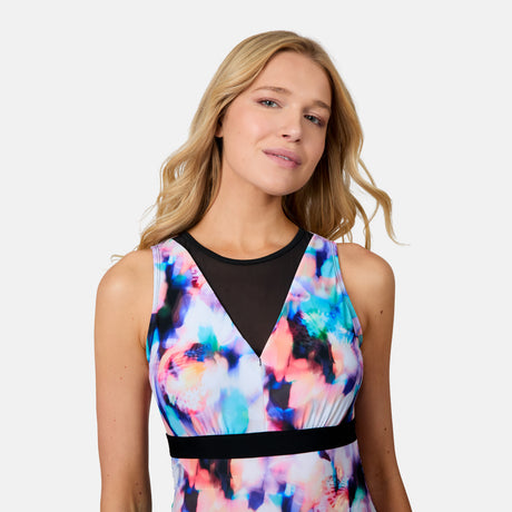 [Emily is 5'10" wearing size S] Woman wearing a colorful dress with a black overlay on a white background