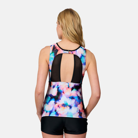 [Emily is 5'10" wearing size S] Woman wearing a colorful tank top with a black mesh back on a white background