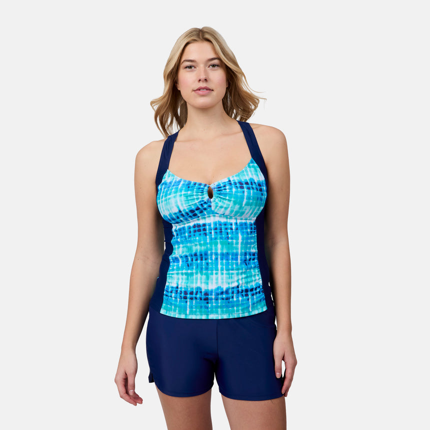 [London is 5'9.5" wearing size S] Woman wearing a blue and white patterned tank top and navy shorts on a white background