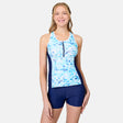 [Emily is 5'10" wearing size S] Woman wearing a blue and white tankini top with navy shorts on a light gray background