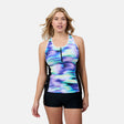 [London is 5'9.5" wearing size S] Woman wearing a colorful athletic tankini top and black shorts on a white background