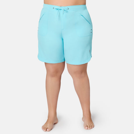 Light blue, quick-drying Women’s Plus Size 10″ Bermuda Board Short featuring a drawstring waist and zippered front pockets.