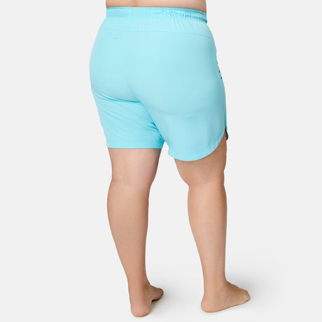 Back view of light blue, quick-drying Women’s Plus Size 10″ Bermuda Board Short on a person.