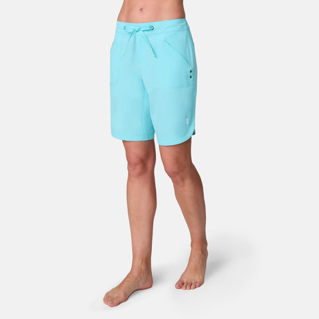 Aqua-colored Free Country Women’s 7″ Bermuda Board Shorts featuring an elastic drawstring waist, side pockets, and UPF 50+ protection.