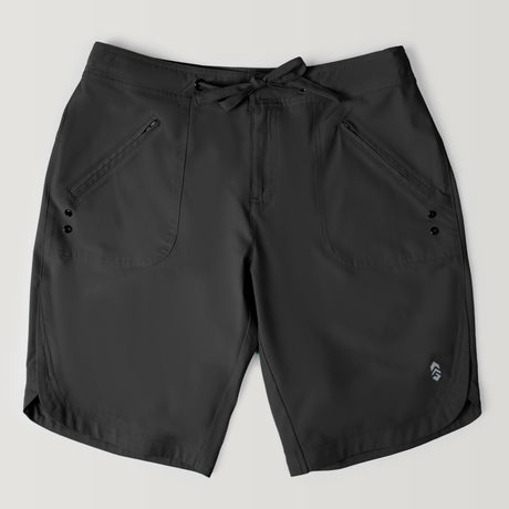 The Women's Bermuda Board Short II in black features quick-drying fabric, front zipper pockets, button accents, a drawstring waistband, and a small logo near the left hem, shown on a light gray background.