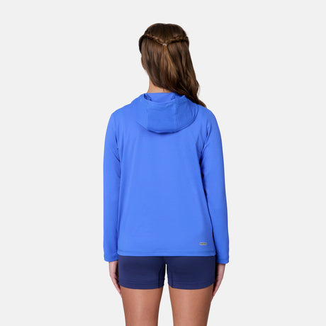 A child wears the Free Country Kids' Everybody SunFree UPF Hoodie in bright blue, made from recycled polyester, with dark blue shorts against a plain light background—perfect for sun protection.