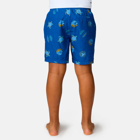 [Model is wearing a size Medium.] Boy wearing the Free Country Boys' Sunset Voyage Swim Short in Blue Sunset Voyage, size M, featuring recycled polyester fabric and elastic waistband and upf protection, paired with white sunshirt #color_ Blue-Sunset-Voyage