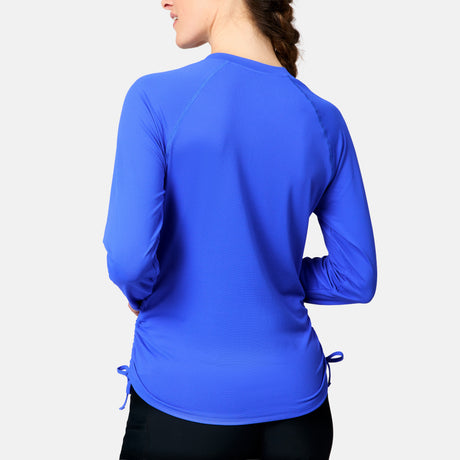 [Kaitlyn is 5'9" wearing size S.] Person wearing a blue long-sleeve athletic shirt on a light gray background