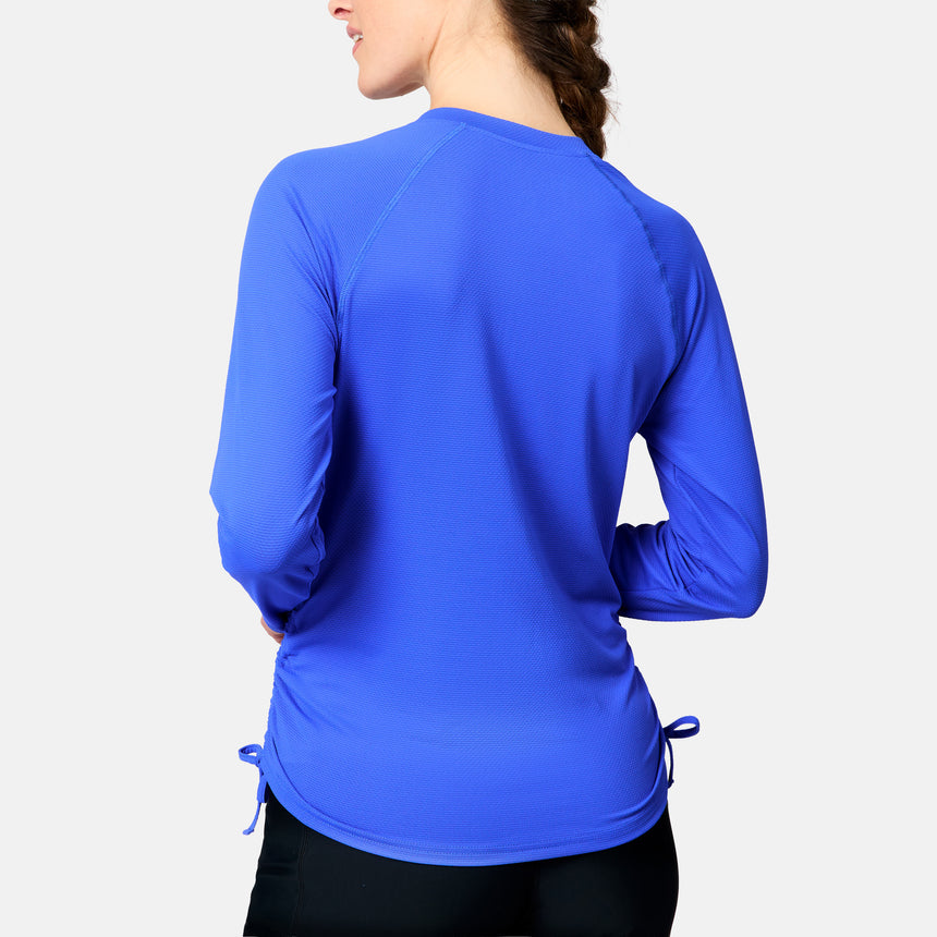 [Kaitlyn is 5'9" wearing size S.] Person wearing a blue long-sleeve athletic shirt on a light gray background