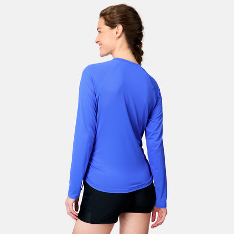 [Kaitlyn is 5'9" wearing size S.] Woman wearing a blue long-sleeve athletic shirt on a light gray background