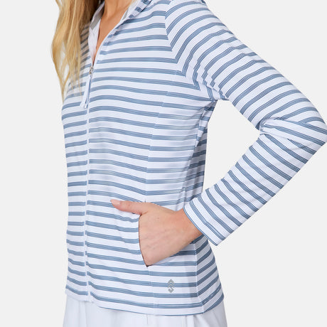 A woman models the Free Country Women's SunFree Full Zip UPF Sunshirt, a white jacket with thin blue stripes and pockets. Only her lower face and upper body appear against a plain white background.