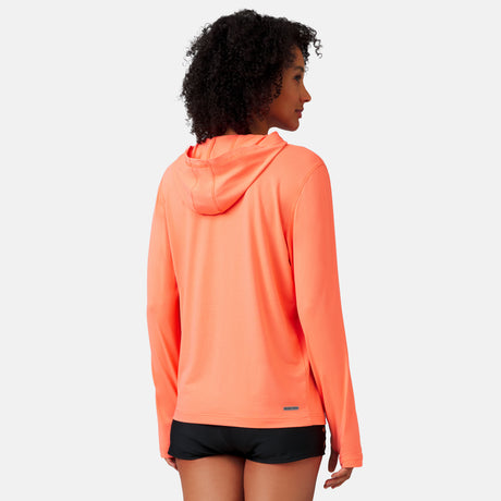 [Victoria is 5'10" wearing a size Small.] Woman wearing Free Country The Everybody SunFree UPF Hoodie in Papaya, size M, made from moisture wicking stretch UPF performance fabric featuring  an attached hood 