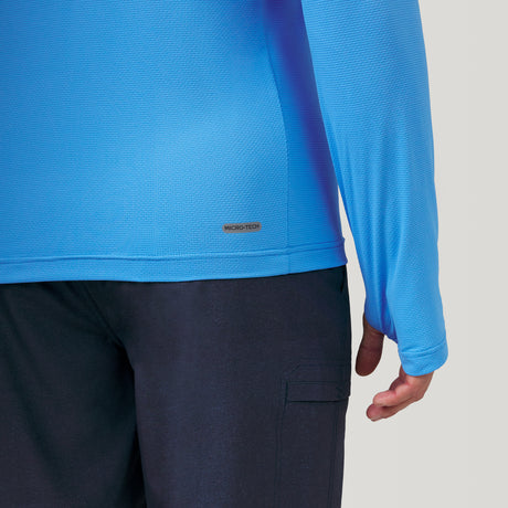 [Justin is 6'1" wearing a size Medium.] Man wearing Free Country The Everybody SunFree UPF Hoodie in Sky, size M, made from moisture wicking stretch UPF performance fabric featuring an attached hood 