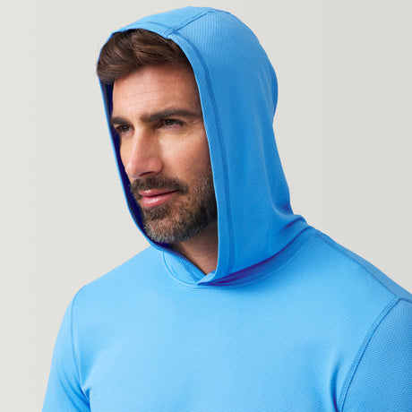 [Justin is 6'1" wearing a size Medium.] Man wearing Free Country The Everybody SunFree UPF Hoodie in Sky, size M, made from moisture wicking stretch UPF performance fabric featuring an attached hood 