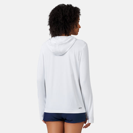 [Victoria is 5'10" wearing a size Small.] Woman wearing Free Country The Everybody SunFree UPF Hoodie in White, size M, made from moisture wicking stretch UPF performance fabric featuring  an attached hood