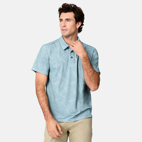[Jacob is 6’1.5" wearing size M]Man wearing a light blue patterned polo shirt on a white background