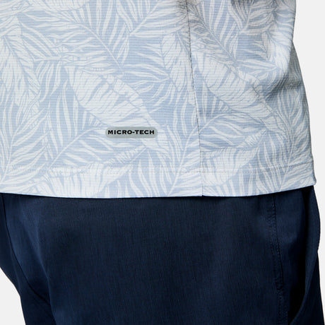 [Scott is 6’3" wearing size M] Close-up of a person wearing a light blue patterned shirt with navy pants on a plain background