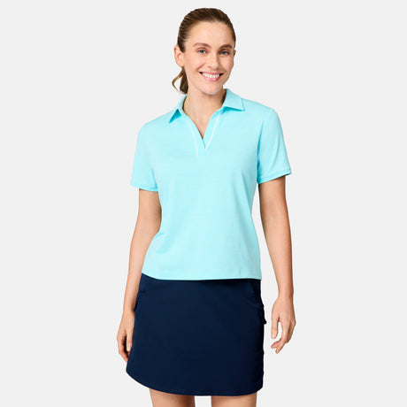 [Brooke is 5'9" wearing size S] Woman wearing a light blue polo shirt and navy skirt on a white background