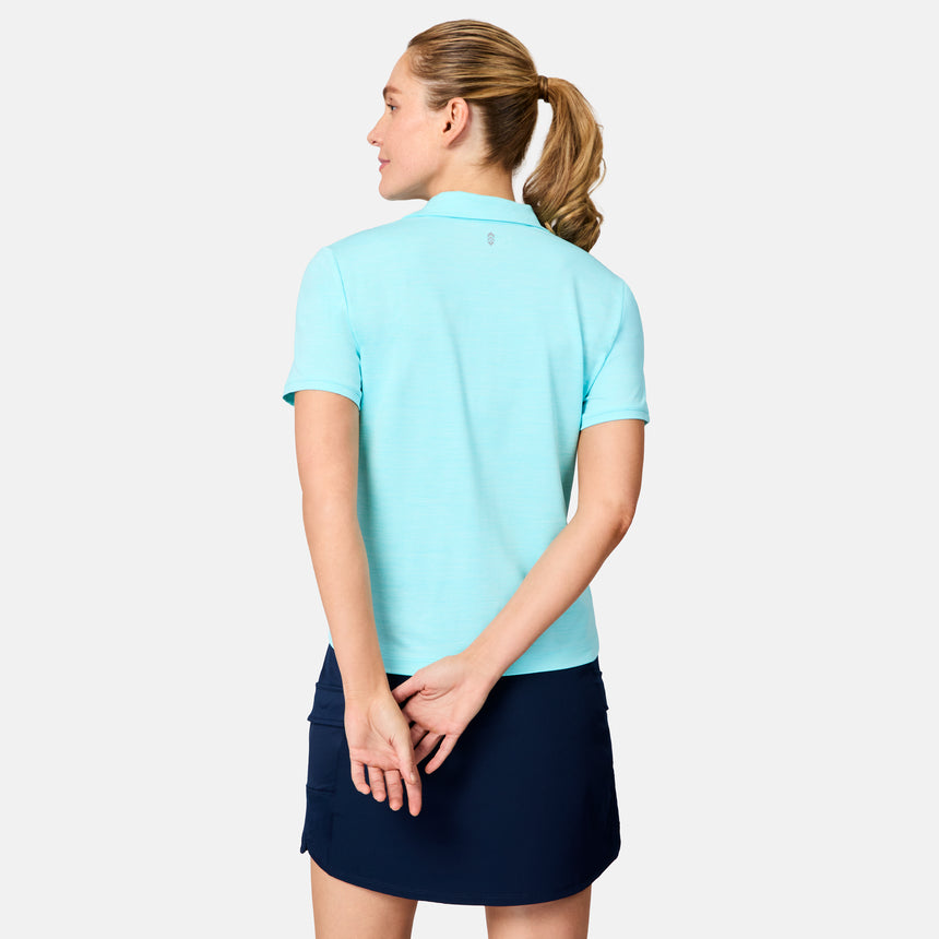 [Brooke is 5'9" wearing size S] Woman wearing a light blue polo shirt and navy skirt on a white background