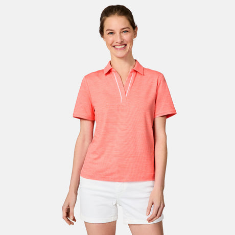 [Kaitlyn is 5'9" wearing size S] Woman wearing a coral polo shirt and white shorts on a light gray background