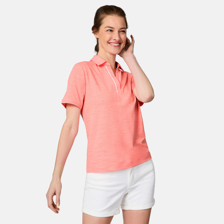[Kaitlyn is 5'9" wearing size S] Woman wearing a coral polo shirt and white shorts on a light gray background