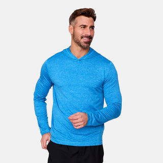 [Justin is 6'1" wearing a size Medium.] Man wearing Free Country Men's Textured SunFree UPF Hoodie in Royal, size M, made from moisture wicking stretch performance fabric featuring an attached hood and thumbholes, styled with black shorts #color_royal