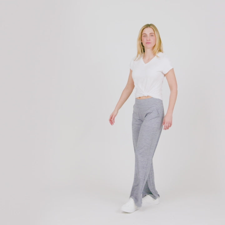 Model wearing the Women's Cloud Knit Wide Leg Pants in light heather grey, worn with a white tee
