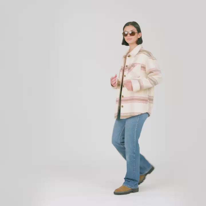 Model wearing the Women's Hayley Plaid Shacket in cream and pink plaid