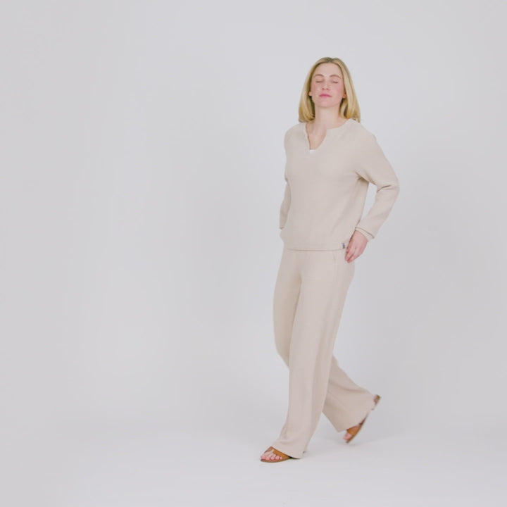 Model wearing the Women's Ripple Knit Long Wide Leg Pant in oatmeal beige, worn as a matching set