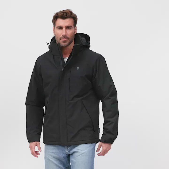 Model wearing the Men's Denali Insulated Jacket in dark charcoal modeling its various features like zipper pockets, full zip front and hood.