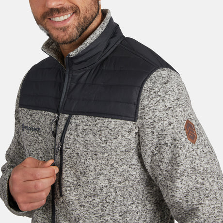 [Model is wearing size M.]  Man wearing Free Country Men's Frore Knit Fleece Jacket in off white with a full zip front, zipper chest pocket, light grey background. Perfect men’s jacket for fall weather.