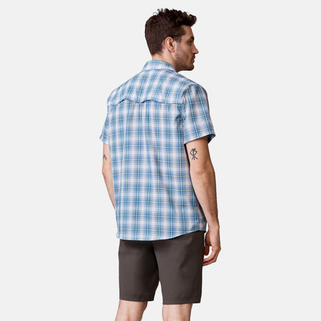 [Will is 6'2" wearing a size Medium.] Man is wearing Men's Excursion Short Sleeve Poplin Shirt in Vintage Cream Plaid, size M, made from lightweight moisture wicking polyester fabric featuring vent at the back, full button down front, and a stand collar, styled with brown shorts #color_vintage-cream