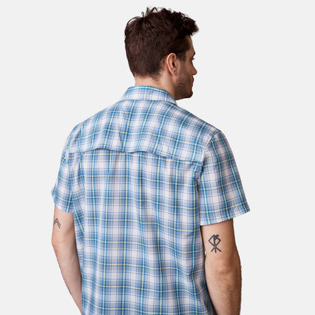 [Will is 6'2" wearing a size Medium.] Man is wearing Men's Excursion Short Sleeve Poplin Shirt in Vintage Cream Plaid, size M, made from lightweight moisture wicking polyester fabric featuring vent at the back, full button down front, and a stand collar, styled with brown shorts #color_vintage-cream