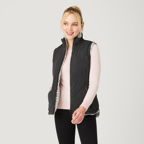 [Model is wearing a size Small.] Women's Stratus Lite Reversible Vest - Black - S #color_black