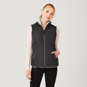 [Model is wearing a size Small.] Women's Stratus Lite Reversible Vest - Black - S #color_black