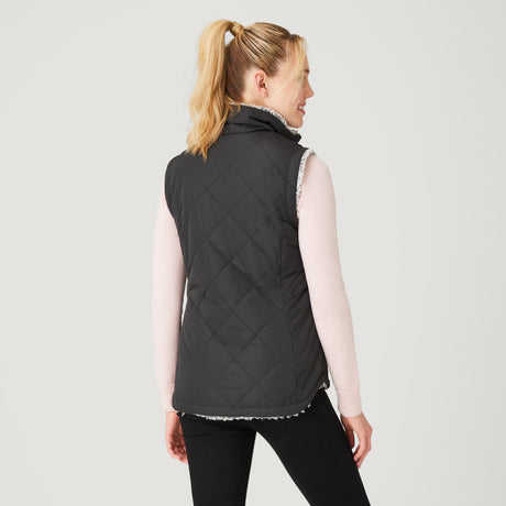 [Model is wearing a size Small.] Women's Stratus Lite Reversible Vest - Black - S #color_black