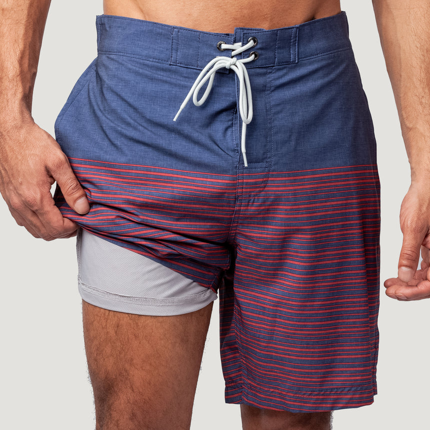 [Model is wearing a size Medium.] Men's Lake Side Stripe Surf Short - Redrock #color_redrock